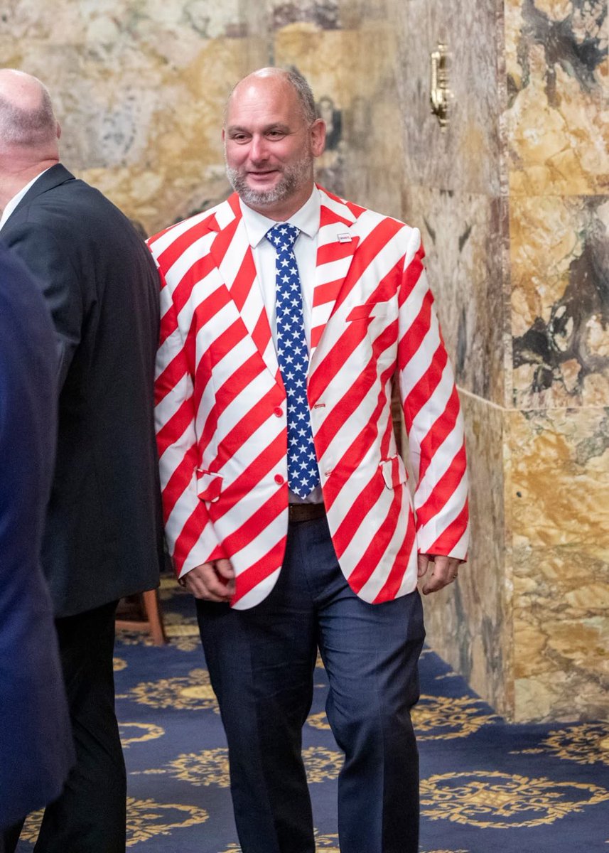 MissyIsMaga's tweet photo. A republican was recently removed from the House floor for wearing this before America’s 250th birthday.

But Ilhan is able to fly a Somali flag everywhere she goes, all day long, trashing America as “one of the worst countries on earth”… but patriotic attire is unacceptable?!?

ARE WE IN AMERICA OR ARE WE IN SOMALIA?
I’m fed up!