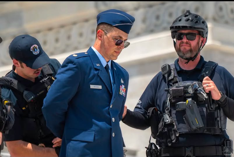JamesTate121's tweet photo. An active-duty member of the United States military stood on the steps of the Capitol, in uniform, and called for the impeachment, conviction, and removal of Donald Trump. He was arrested.
He didn’t stumble into this. He knew exactly what he was doing.
Under Department of Defense rules and the Uniform Code of Military Justice, active-duty service members are heavily restricted from engaging in partisan political activity, especially in uniform. Depending on how this is charged, he could be facing violations like Article 92 (failure to obey orders or regulations), and for officers, even Article 88 (contempt toward officials). That’s not a slap on the wrist, that’s career-ending territory. Court-martial, loss of rank, forfeited pay, even prison time are all on the table.
He risked everything: his career, his pension, his freedom, and the future he built inside the military.
And he did it anyway.
You don’t have to agree with what he said to recognize what it took to say it. Real courage isn’t reserved for safe opinions or popular moments. It shows up when the cost is clear, and you move forward anyway.
The military demands discipline and neutrality for a reason. But history is full of moments where individuals inside institutions decided that staying silent was the greater violation.
That tension, between duty to the system and duty to conscience, is where this story lives.
Maybe you think he crossed a line. Maybe you think he drew one.
But let’s not pretend this was casual. This was deliberate. This was informed. This was someone fully aware of the consequences choosing to act anyway.
Time will decide how this moment is remembered. It always does.
But one thing is undeniable: he knew the price, and he spoke anyway. VIA!~~~ Melinda Fulton