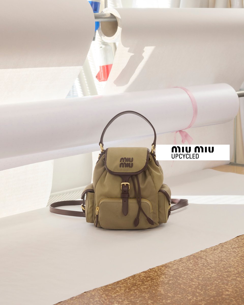 MIUMIUofficial's tweet photo. In Miu Miu Upcycled 2026 collection, vintage trousers are transformed into useful khaki pouches or backpacks, embroidered with signatures small crystal flowers. 
Discover the 2026 collection via https://t.co/usfjBStfWc and in selected stores worldwide.

#MiuMiuUpcycled #MiuMiu https://t.co/YCXfo1g339