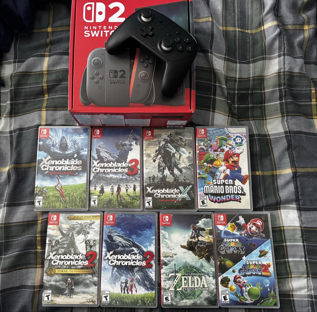 RuneKingRhoam's tweet photo. My physical purchases in the last 30 days.

Could’ve bought a PS6 but this was more appealing. #NintendoSwitch2 https://t.co/5vpreVWrQT