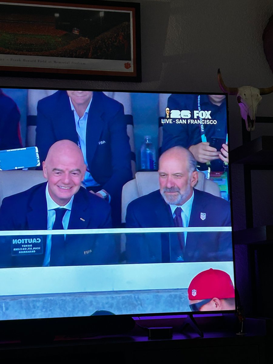 boorzman's tweet photo. Howard Lutnick sitting comfortably next to the FIFA president. What a disgrace https://t.co/zc1tHgam87