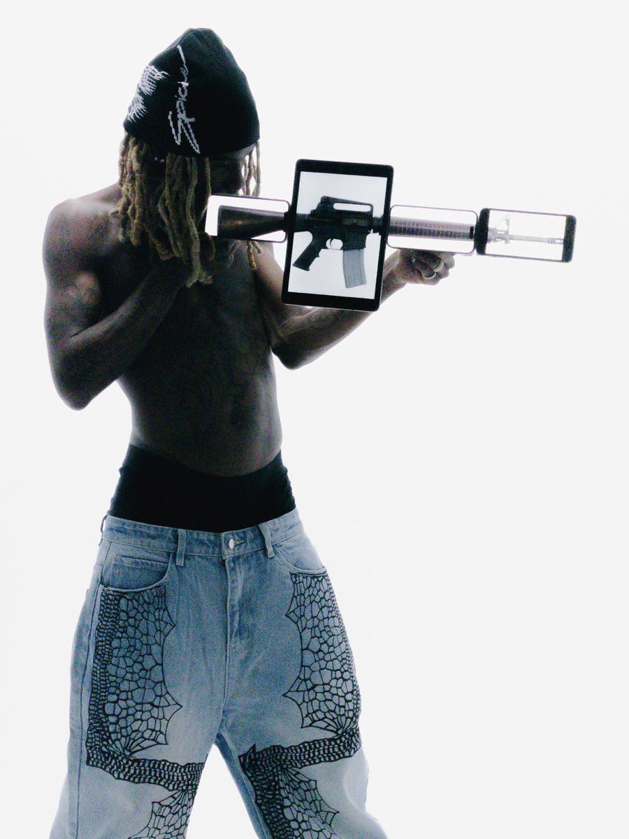 catalogging's tweet photo. OsamaSon for Spicie Brand Streetwear Drop (2026)

He is seen holding up 3 phones and a tablet which resembles a prop. https://t.co/ido7t4uLJQ