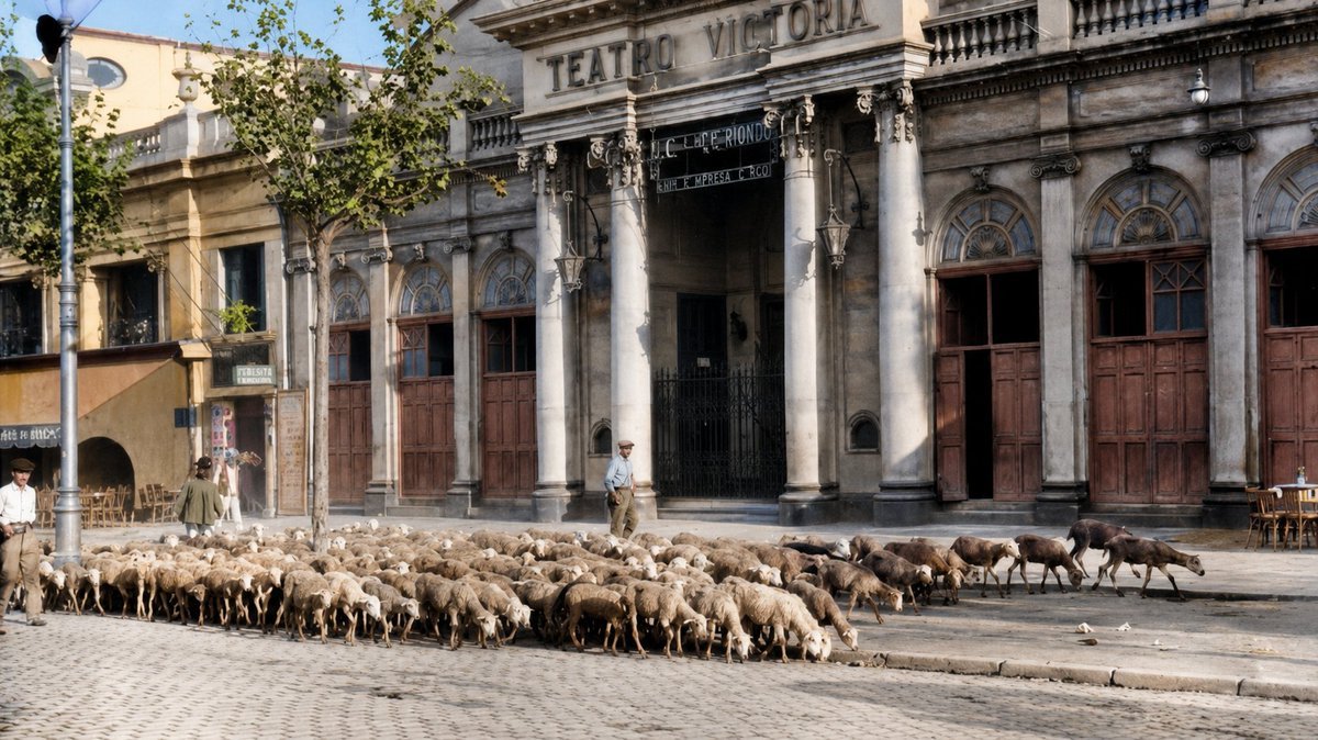 CatalunyaColor's tweet photo. Un ramat de xais passant per davant del Teatre Victòria, el 1938. https://t.co/5zfwCq0CnS