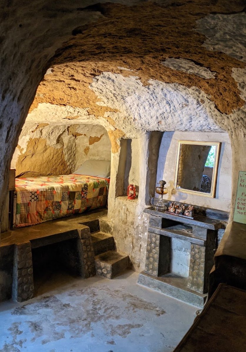 MoundLore's tweet photo. In the early 1900s, a Sicilian immigrant looked at California’s summer heat and decided the answer wasn’t a better house. 

Baldassare Forestiere arrived in the San Joaquin Valley expecting to grow citrus.  The ground gave him hardpan instead: a dense, cement-like layer under the surface that fought roots, held water, and made a normal orchard almost useless.

So he started digging.

For nearly forty years, mostly by hand, Forestiere cut almost ten acres under Fresno into rooms, tunnels, arches, courtyards, and gardens. Sun came down through openings. Air moved through shafts. Oranges, lemons, grapefruit, grapes, and pomegranates grew from sunken courts, with the worst of the San Joaquin Valley heat left above them.

He had no architecture degree. No engineering firm. No machinery doing the real work. Just hand tools, Sicilian memory, and a problem that kept getting deeper the longer he answered it.

The Forestiere Underground Gardens are usually treated like a roadside oddity. That undersells them. This is immigrant architecture, climate adaptation, stubborn farming, and one of the strangest built landscapes in America all sitting under the same patch of Fresno.

A failed orchard became a buried world.