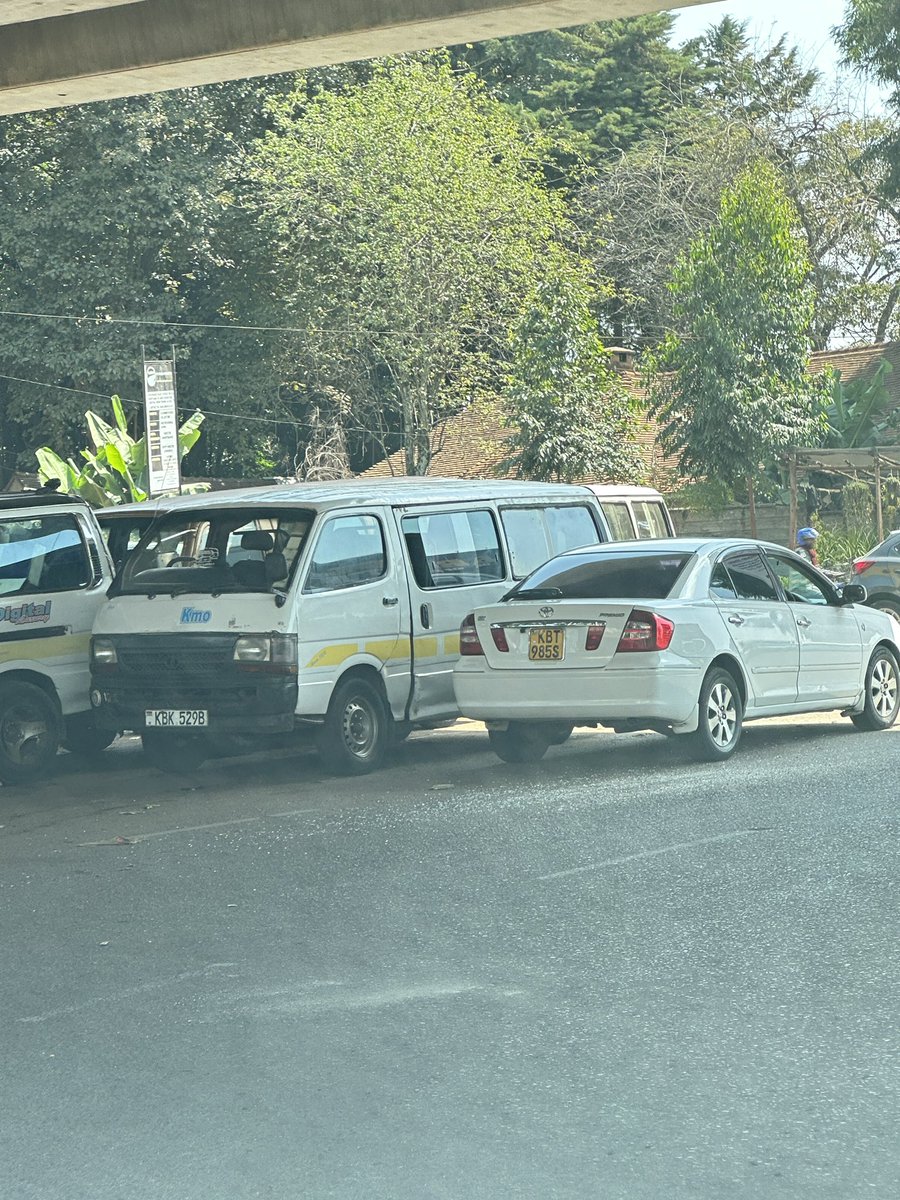 Alfayaz11's tweet photo. The ABC Place roundabout is now officially a parking lot for matatus, Ubers, tuk-tuks, smokie carts and small vibandas. What is even more interesting is that those entrusted with upholding and enforcing the law also park their private vehicles there, where they can often be found relaxing comfortably after they’ve eaten a heavy meal. 

#ReclaimNairobi