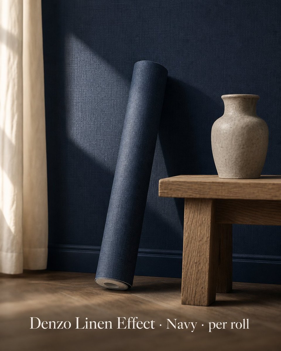homespacedirect's tweet photo. Navy reads differently in afternoon light. The Denzo linen-effect surface catches the warmth, softening what could feel heavy into something quietly architectural. A woven wall breathes where a flat one absorbs. £17.25 per roll. https://t.co/n1zvmsJmqg