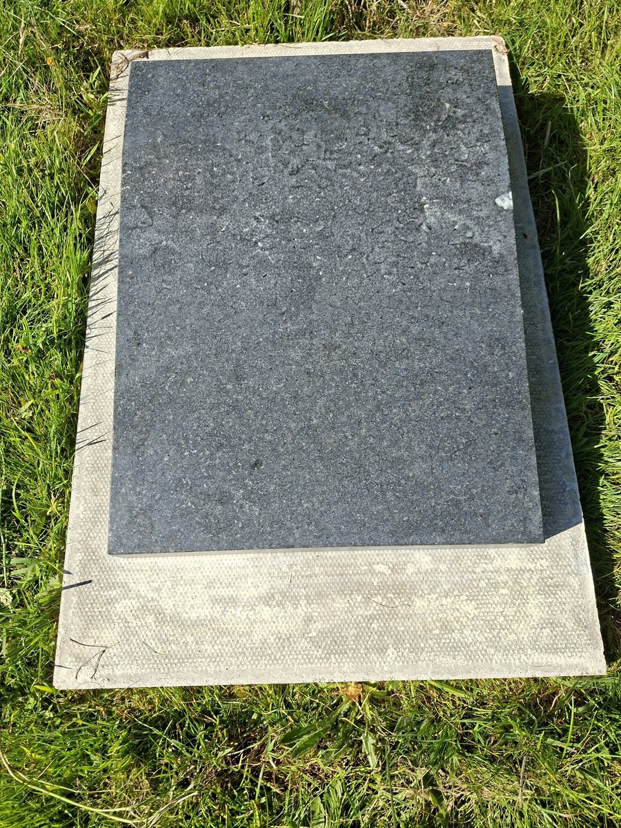 higgyboson's tweet photo. I've just been informed by Devon and Cornwall Police @DC_Police that the stone mason company who stole the concrete slab from my Sons grave and moved it to someone elses grave where they cemented a memorial stone to it have not committed any crime.

This is despite the fact they disturbed the structure of my Sons grave, STOLE a component part of it and walked away from the cemetery leaving my Sons grave completely uncovered. 

I'm absolutely astounded at this decision.

It was discovered in this state by my Grand Children who went to lay flowers on Fathers Day.

(I've blurred out the name on the memorial stone).