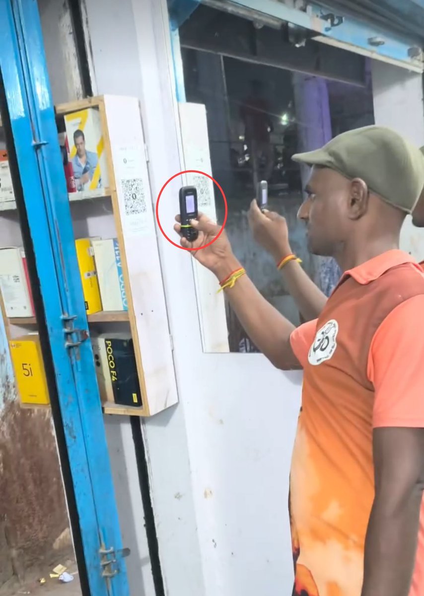 CountryGulshan's tweet photo. A poor man went to a mobile shop to buy a charger.

The shopkeeper asked, “What do you need?”

The man replied, “I want a charger.”

The shopkeeper said, “It costs ₹150.”

Without saying much, the man agreed to buy it.

But when it was time to pay, he pulled out a Jio Bharat Phone keypad phone from his pocket.

Seeing that, the shopkeeper and the people standing nearby smiled, wondering how he would make the payment.

But within a few seconds, the man opened his phone and completed the online payment.

The shopkeeper asked in surprise, “Payment done already?”

The man showed him the screen.

Seeing this, the shopkeeper and everyone there laughed and said they were seeing online payment being made from a Jio Bharat keypad phone for the very first time.