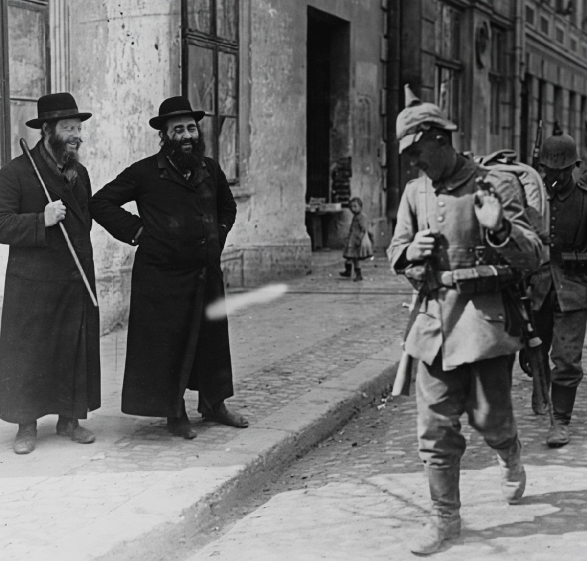 Parodyjeffx's tweet photo. Two Ashkenazi Rabbis
photographed laughing at a German soldier going off to fight in WWI.

What could possibly be so funny? https://t.co/cAcbuWFNIr