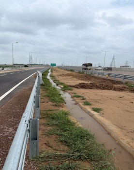 NHAI_Official's tweet photo. NHAI would like to inform that the road surface cave-in at Km 55+480 on the Delhi–Dehradun Economic Corridor occurred due to water stagnation following rainfall, coupled with constraints in commissioning the permanent cross-drainage system at the location.

The affected stretch was identified during routine route patrolling in the early hours of 01 July 2026, and restoration works were immediately undertaken. The location was repaired on priority, ensuring safe and uninterrupted movement of traffic.

The balancing culvert at the location, designed to safely convey rainwater across the carriageway, could not be commissioned due to continued resistance from local residents, who have been using the culvert opening as a vehicular crossing. In addition, permanent slope protection and chute drain works remain pending owing to an ongoing land-related dispute, which has prevented execution of the approved drainage infrastructure.

As an interim measure, NHAI has commenced construction of a parallel drain over approximately 1.5 km long and is redesigning the drainage gradient to ensure safe disposal of rainwater until the permanent drainage system can be commissioned. The location is under continuous monitoring, and all necessary resources have been deployed to ensure safe and smooth traffic movement. NHAI remains committed to maintaining the highest standards of highway safety through timely maintenance and proactive asset management.