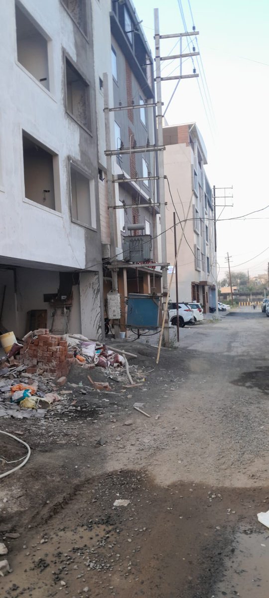 HKVResidents's tweet photo. In Hare Krishna Vihar. Nipania, transformers have been installed vertical to road and blocked compete footpath. Footpaths were meant for pedestrians however now allows building owner to use as personal parking. 
#Call1912 #CustomerCareExcellence #Mppkvvcl #Mpebindore #Westdiscom https://t.co/BrTnbkzmrV