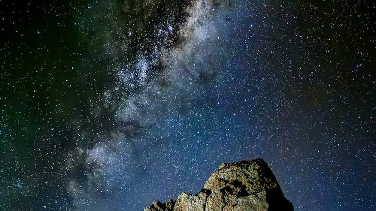 shanaka86's tweet photo. We may be the last generation to see the stars, and the reason is that we are teaching machines to think. Just maybe.

Astronomers just published a hard number. 

If more than 100,000 satellites orbit Earth, ground-based astronomy suffers drastic losses. 

We are at roughly 14,000 today. 

Companies have already filed to launch 1.7 million. 

The largest single plan is SpaceX's proposal for a million satellites, and its own filing says why: Earth cannot supply enough power and water to cool them, so it wants the data centers in orbit, run on endless solar power and cooled by the vacuum, to feed the AI boom.

That is the whole story of this era. 

Artificial intelligence grew so hungry it strained the power grid and drained the water table, and now, chased off the planet, it threatens the oldest science we have. 

The lead astronomer, asked about the extreme case, did not soften it. Past a certain point, he said, “there is no reason to run the telescopes, because the data will be corrupted”. The study finds almost every image from the largest camera ever built, the new Rubin Observatory, would be rendered “unusable”.

However the surreal part sits in the same regulatory file. 

A second company wants 50,000 giant mirrors to reflect sunlight down at night, each as bright as the planet Venus, together enough to make the sky three to four times brighter. 

So in one docket, humanity is quietly deciding whether to trade away both the stars and the dark. 

One firm would dim the heavens to power the machine. The other would wash out the night.

Elon’a answer to the warning was four words. “Space is really big”

For 400 years, since Galileo turned a lens upward, the sky was how we learned what we are where we are etc. We may be the first generation to build a mind that sees everything, and the last that can still see the stars. You need a heavy drink to ponder this…