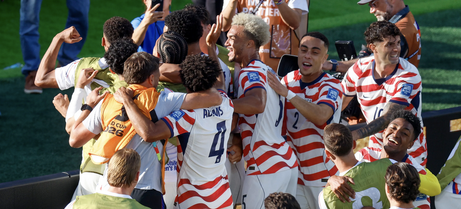stevemagness's tweet photo. The US was down to 10 men, clinging to a 1-0 lead in a World Cup knockout. 

During a break , Pochettino gathered them and said:
"(This is) the moment to show it's not only empty words when we say we are a family. To compete, to fight for each other."

It Sounds like a cliché, but science backs it up. How adversity can bond and unlock a team.

When we face adversity, especially if it seems unfair, it can either make our internal governor throw in the towel or release the reins to give us more effort. 

If we act like the situation is rigged, that we're doomed, that we're out there alone, we often default to "why try mode." We have a built in excuse for losing and the odds seem overwhelming.

If we treat it as we're the underdogs now, our backs are against the wall but we've got the folks to get it done, we increase effort. Our brain says "this is worth it, let's give it a shot."

A lot of that comes down to the family line...

Every team says they're a family. But most of the time it's akin to a poster on the wall or a cheap slogan no one really believes.

It sounds good, but has nothing behind it.

You don't really find out if its a slogan or not until reality smacks you in the face. When you're exhausted, down a man, and protecting yourself would be so much easier than covering for your teammate.

Psychologists have a name for what turns a group into a family: Identity fusion.

Go through something hard enough together and the line between "me" and "us" starts to blur.cWe start to share perception, action, and even a feeling of oneness.

And once you're fused, you'll do things for the group you'd never do for yourself. 

In some cases this can be very bad: think cults and groups where we throw our individual values out the door and follow the group.

But in sport, it can be what takes us to another level.

It's the same force behind soldiers and lifelong teammates. We bond by going through something real, that you can't manufacture, that forces us to put down the facade and be who we are.

"One man's down, the next guy steps up… We're more than just one player. We're more than just 11 players." USMNT player Chris Richards

What Pochettino has done is get guys actually believing it. Again, next man up is cliche.

But if you can get folks to truly believe that your teammates are your brothers, that you've got each others back, it increases the effort you can give when you face a challenge.

We evolved to share the load. It's baked into our DNA. And for good reason, if we were alone by ourselves hunting on the savanna, we we're probably screwed.

Research found that when we simply hold a loved ones hand, it decreases the threat network in our brain, helping us handle a painful electric shock better.

Oxford researchers found that when rowers trained together, moving in unison, they were able to tolerate nearly twice as much pain as when they were training alone.

When the "I" becomes "we," the burden of pain is distributed.

It's the entire reason the US military does long marches and drills in unison. We call it "muscular bonding," and research shows it helps create that sense of oneness.

It's not as simple as doing hard things together.

It's cultivating an underlying culture where trust is the foundation. Where you will sometimes screw up, but you know that those around you support you and want you to be better.

It's knowing that the leader has the actual best interest at heart, that they care, and aren't just doing it for the paycheck, the reward, or their ego.

It's the hardest thing in sport to create. But when you do, it's magic.

Adversity tests us. It reveals who we are, both as an individual and a group.

If you've got the culture right, it pulls you together. There's not much more powerful than a shared sense of us against the world.

A family isn't the guys who celebrate together. It's the ones who, when a teammate goes down, look around and think: my turn to carry more.