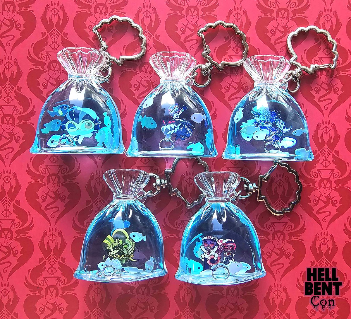 hellbentcon's tweet photo. Shake around your favorite lil guys in these adorable mini fish bag inspired liquid charms~🌊☀️

the link is in our bio, then click the Etsy button~🌟✨️

#hazbinhotel #helluvaboss #hellaverse #baxter #vox #chazwickthurman #glitzandglam #velvette #valentino https://t.co/l1OJP7JVHV