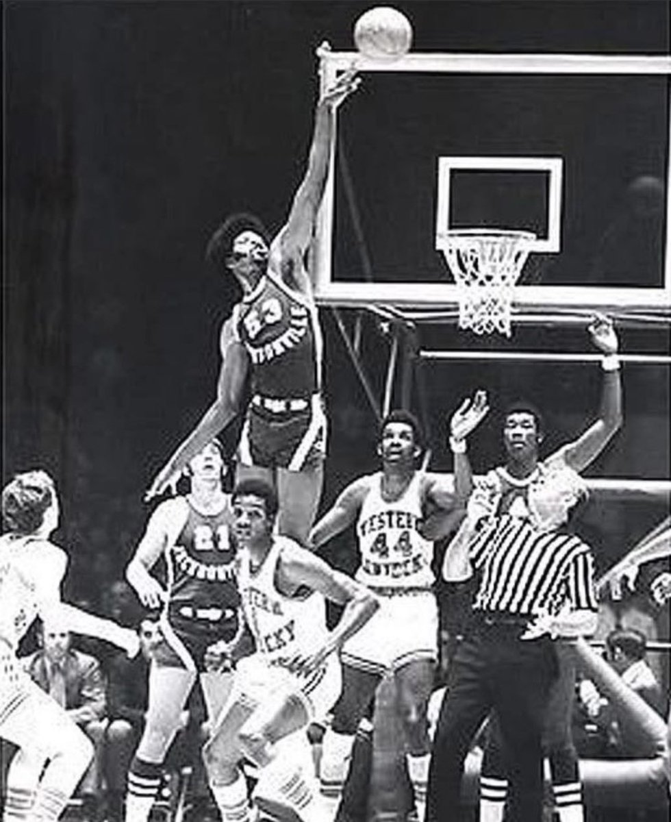 nut_history's tweet photo. Artis Gilmore - What makes this picture so unusual is that it’s actually a jump ball at one of the free throw circles where the player from Western Kentucky knowing he has no chance to get the tip https://t.co/D3we1Og7ig