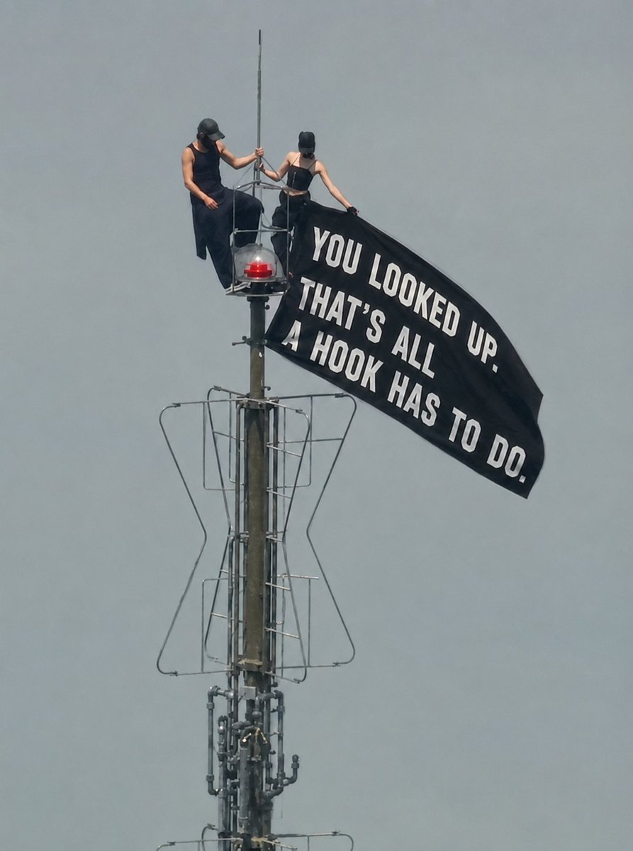 shiafkos's tweet photo. Two people climbed over 1,400 feet and risked a felony to make a city look up.

Most ecom ads can't make a thumb pause for half a second, and they cost more than the climb.

A hook has one job: earn the next line. 

That's it. 

These two just did it the hard way. https://t.co/5kAvT3R1cm