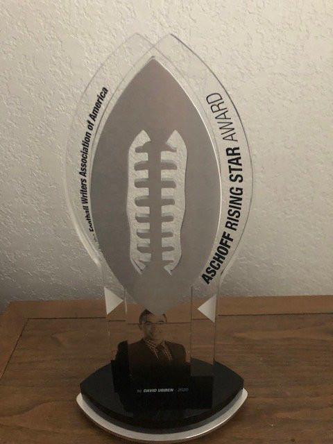 TheFWAA's tweet photo. Pick Six Previews' Brett Ciancia, 33, has claimed the FWAA's Edward Aschoff Rising Star Award. He is the seventh recipient of the the award named for the beloved ESPN college football reporter reporter who passed away on Christmas Eve in 2019 on his 34th birthday from previously undetected Stage 4 non-Hodgkin's lymphoma in his lungs.