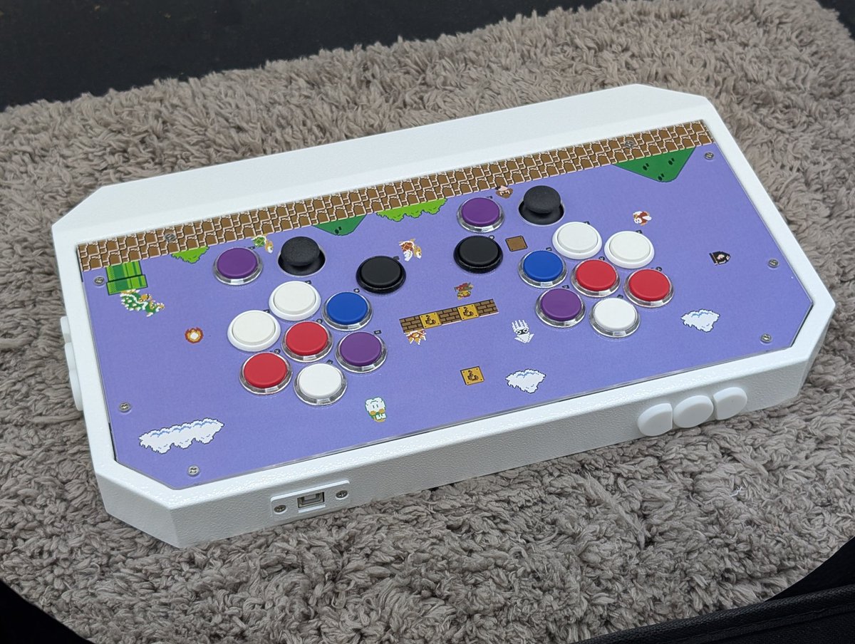 HuangAsh's tweet photo. Controller for Pac Man on Switch 2. (Although top plate is Mario theme😅)
It uses Flashtap buttons with Nylon caps, and double anolog sticks.
Zoom in on the image, you can see the key layout—it’s super weird.
#PacMan
#Flashtap https://t.co/zlKz75WBlo