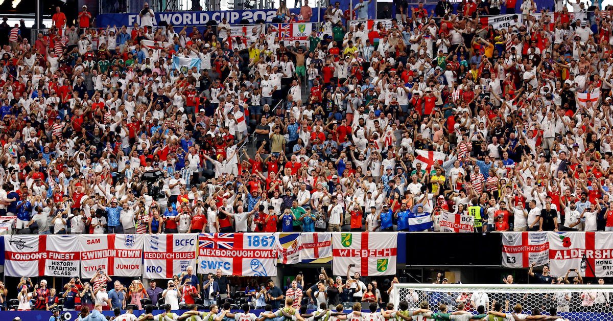 harry_is_boring's tweet photo. Stands lined with England flags decorated with club names and crests etc. is one of the great sights in football tbh https://t.co/wiqLyzlCWD