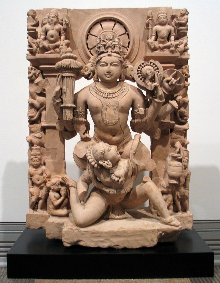 The_Chandela's tweet photo. Chandela Vishnu Trimurti (Narasimha, Varāha, and Vishnu), seated on Garuda. Late 10th century CE. Sandstone. Built by the Chandel empire of Jejakabhukti (Chandela dynasty of Jejakabhukti). https://t.co/WKW8j7TsCs