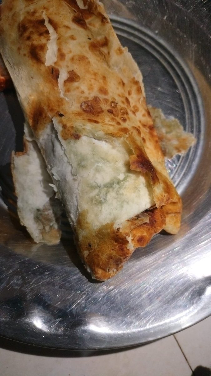 ankit_akash03's tweet photo. I ordered these paneer rolls from Zomato. A worm has come out of it, and fungus also found on it, it is good that I checked it otherwise I could have got food poisoning, this is very irresponsible behaviour, I want a refund and some legal action on this. https://t.co/hdyvjlqSgy