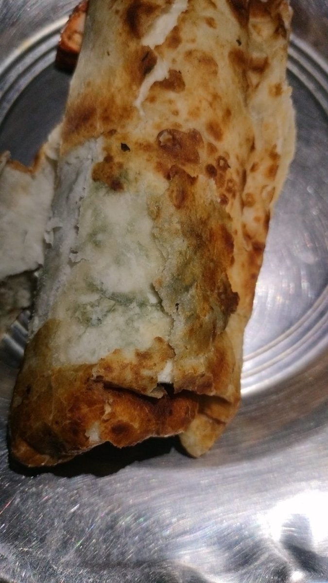 ankit_akash03's tweet photo. I ordered these paneer rolls from Zomato. A worm has come out of it, and fungus also found on it, it is good that I checked it otherwise I could have got food poisoning, this is very irresponsible behaviour, I want a refund and some legal action on this. https://t.co/hdyvjlqSgy