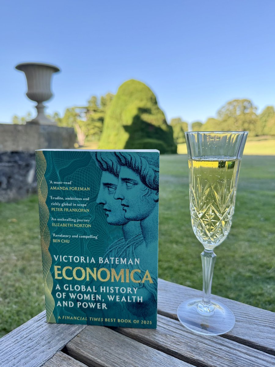 vnbateman's tweet photo. The only way to celebrate the publication of the paperback edition of #Economica in all its gold and green glory - with a glass of champagne in the British sunshine, of course. Cheers to everyone involved in making the book a success 🥂 https://t.co/1fVOoy8idn