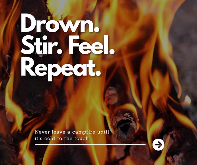 Close-up of bright campfire flames with text urging to never leave a fire until it's cold to the touch.