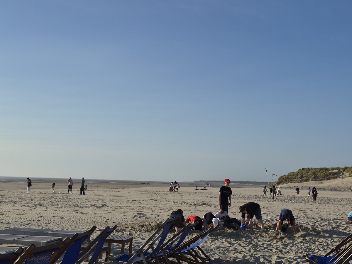 StBenedictDerby's tweet photo. After a very long day the Y7 French trip are enjoying themselves at the beach. #TeamBlue https://t.co/3yMm0qlESe