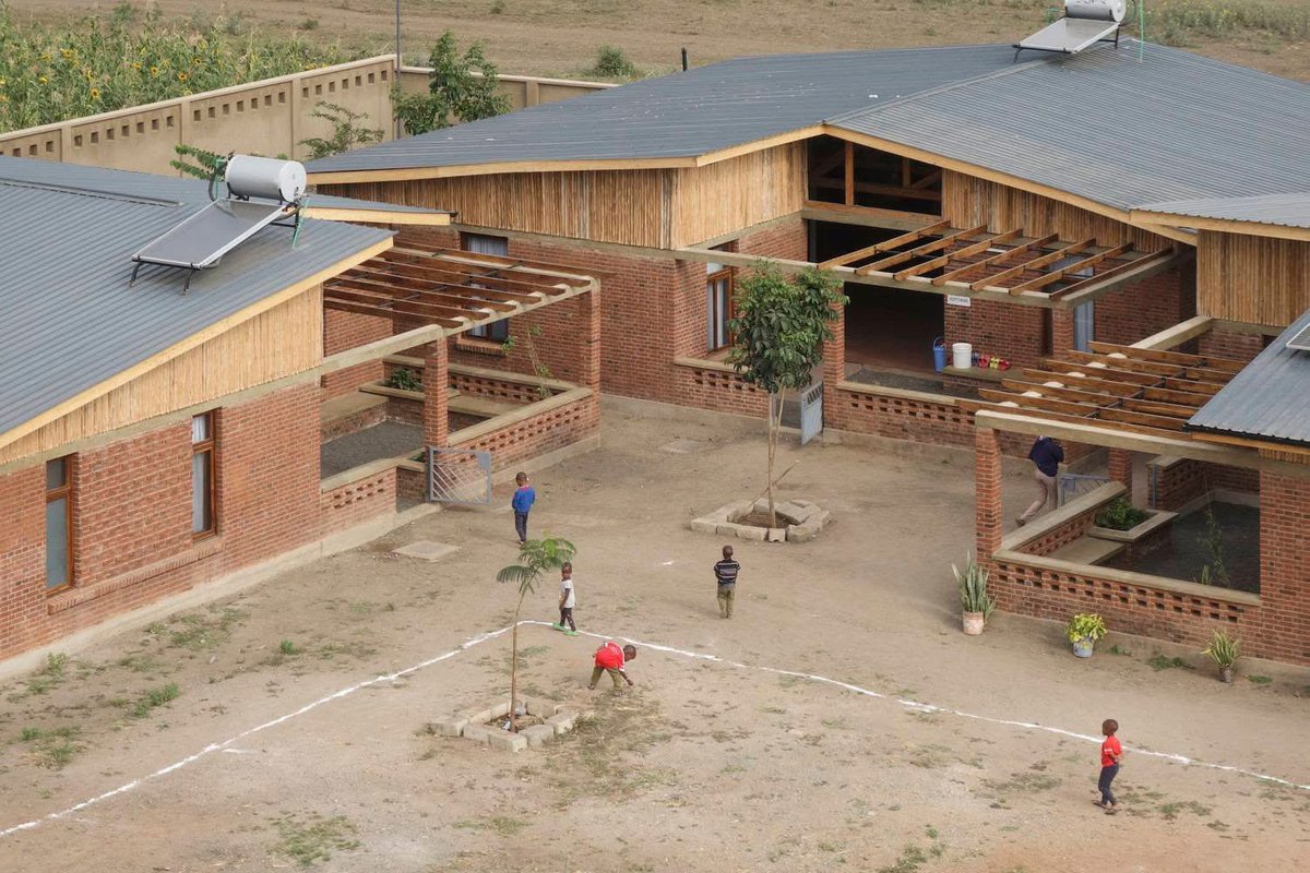 shavnyuyngah's tweet photo. In Tanzania, at the foot of Kilimanjaro, someone asked a question that most governments on this continent have refused to ask. What does a child who has lost everything actually need from a building?

Kao La Amani Children’s Village is the answer. Article 25, working with the Tír na nÓg Children’s Foundation, completed Phase 1 of a children’s village housing 60 children in six family-style cottages, each with a live-in mother, a dining terrace, a library, a games room and courtyards designed for the kind of play that tells a child they are safe. The walls are clad in sisal poles. The bricks are fired with rice husks. The village runs entirely off-grid on solar power, borehole water heated by solar, and waste filtered through constructed wetlands. Nothing imported that did not need to be.

Africa has millions of orphaned and vulnerable children and most of what we build for them reflects exactly how much we value them. Cement rooms. Shared dormitories. Institutions that look like institutions. We give the children who need the most the buildings with the least thought put into them.

Kao La Amani proves it does not have to be that way. Phase 2 is already planned, more living space, staff facilities and community amenities. The children in Phase 1 are already there, laughing, playing and learning in a place that was built specifically around their lives.
We need more of this on this continent. Far more.

Kilimanjaro, Tanzania | Article 25 & Tír na nÓg Children’s Foundation