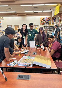 uhmanoa's tweet photo. Through the new GROW program, 10 grad students learned to explain complex research without jargon. They built interactive exhibits and hosted an outreach fair for 60 Waipahu Intermediate schoolers to inspire future young researchers ➡️ https://t.co/GBWCYIO3gK https://t.co/XUZINpUbk4