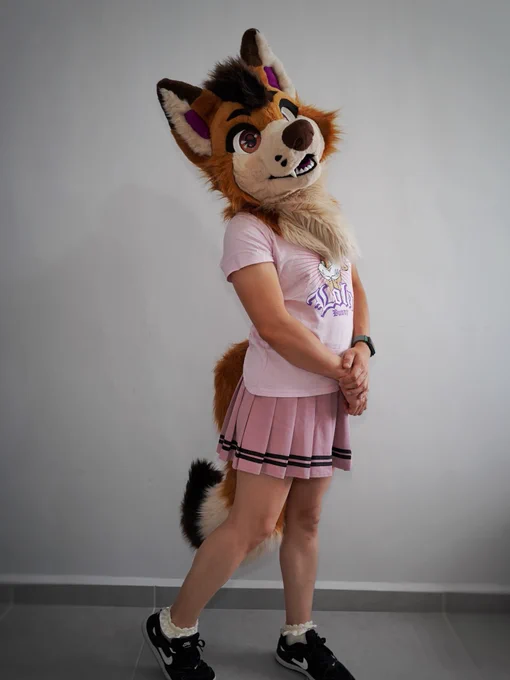 A little fox tries on girls' clothes and feels pretty