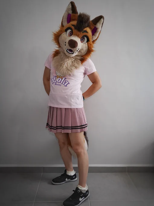 A little fox tries on girls' clothes and feels pretty