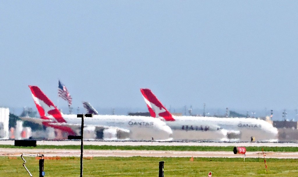 AmyOwl73's tweet photo. The heat shimmer is terrible right now, but there are TWO @Qantas a380s parked at DFW airport... π€©
#planespotting
#avgeeks
#a380
#dfwairport
#foundersplaza https://t.co/uI6MWkqfnW