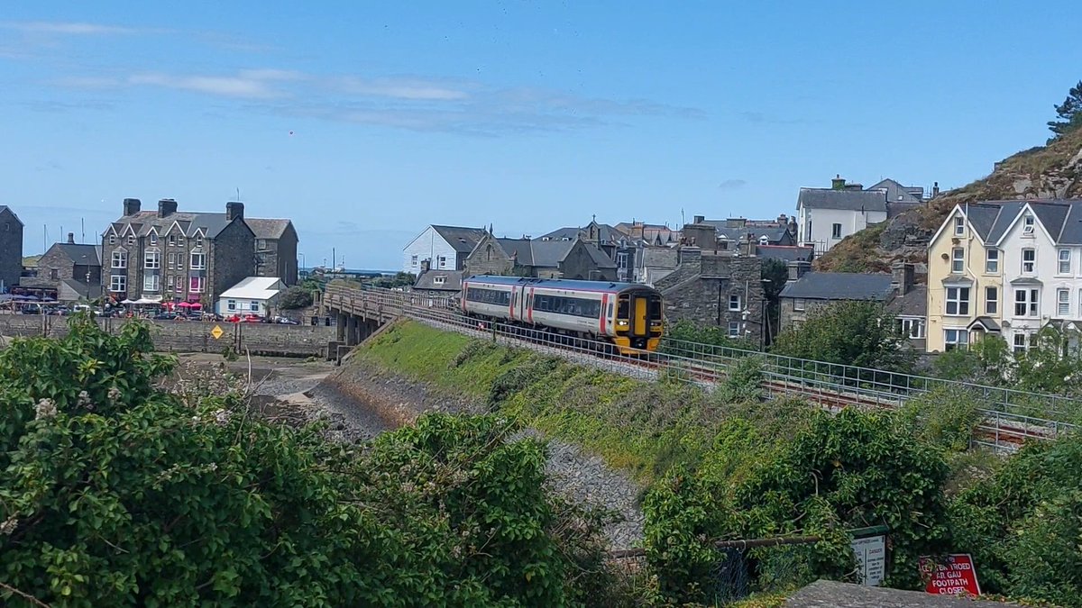 SusanComerie's tweet photo. A little more 158 spotting at #Barmouth on Sunday 28.06.2026 before having to head home, here we have @transport_wales 158839 (again...) & 158822 crossing Barmouth Viaduct & 158835 passing the harbour having just departed the station https://t.co/fbS2aO3p1R