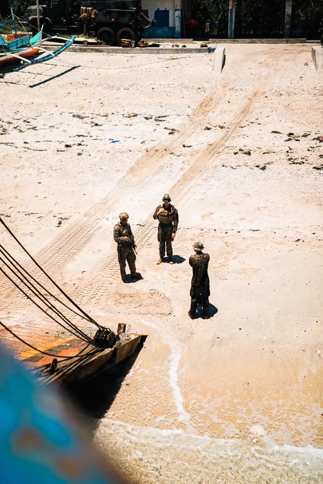 U.S. Marines assigned to 3rd Littoral Anti-Air Battalion, 3rd Marine Littoral Regiment, 3rd Marine Division, prepare to load Marine Air Defense Integrated Systems onto a Philippine surface connector during KAMANDAG 10 at Calayan, Philippines, June 28, 2026. KAMANDAG 10 is a multi-domain, joint, and combined exercise between the Armed Forces of the Philippines and United States military focused on enhancing maritime security, interoperability, contested logistics, and combined readiness throughout the Philippine archipelago. (U.S. Marine Corps photo by 2nd Lt. John Kim)