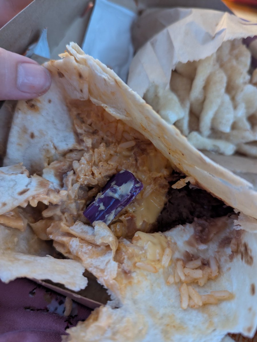 steph1986's tweet photo. . @tacobell who do I need to contact about this huge piece of plastic I found in my cheesy bean and rice burrito?! I just about broke a tooth biting into it. #notcool https://t.co/O5ZqRe8LiP