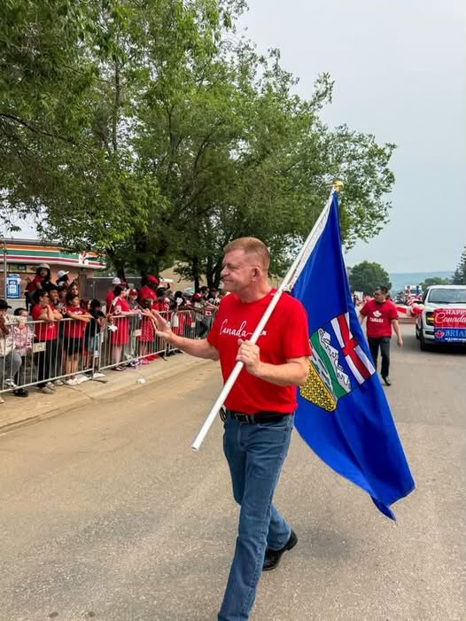 Martyupnorth's tweet photo. Brian Jean carried an Alberta flag during the Canada day parade. https://t.co/miyNj61ZD4