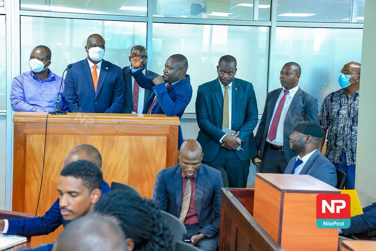 MrBusinge's tweet photo. Timothy Kalyegira, accused of allegedly broadcasting without a license, was in handcuffs as he appeared in court. 

On the other hand, Chris Obore and his six colleagues, accused of stealing over Shs27b, were not handcuffed at any point during their arrest or journey to court. https://t.co/fF2Q5Xg94m