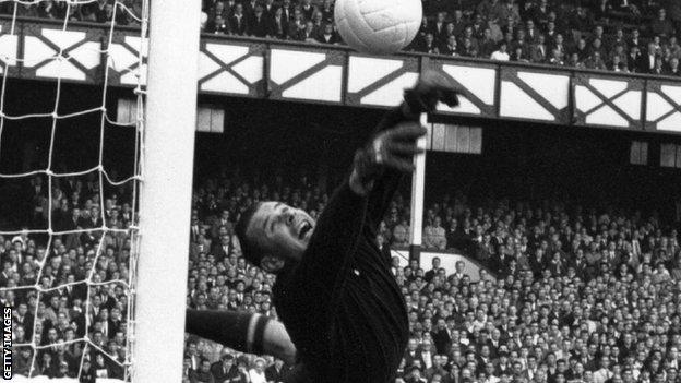 DaveNwali's tweet photo. When One Man Changed the Game

Most people become great by mastering the rules. Lev Yashin became legendary by rewriting them.

Long before modern goalkeepers were expected to sweep behind their defenders, organize the backline, or launch attacks with precise distribution, Yashin was already doing it.

He wasn't content with standing on his goal line waiting for danger to arrive. He attacked the danger first.

Born in Moscow in 1929, Yashin spent part of his childhood working in a weapons factory during World War II. Football became more than a sport—it became his escape.

Over the next two decades, he devoted his entire professional career to Dynamo Moscow, rejecting lucrative opportunities abroad to remain with the club he loved.

On the pitch, he looked different. Dressed entirely in black, he seemed to cover every corner of the goal. Opponents celebrated scoring against him as though they had won a trophy.

He saved more than 150 penalties. He kept over 270 clean sheets. He won Olympic gold, a European Championship, and in 1963 achieved something no goalkeeper has repeated.

He won the Ballon d'Or. Not as the best goalkeeper. As the best footballer in the world.

But perhaps his greatest achievement wasn't the trophies. It was changing how the position itself was played.

Every modern goalkeeper who confidently leaves the goal line, commands the penalty area, and starts attacks owes something to Lev Yashin.

Real leaders don't just excel within existing systems. They build better ones. Innovation isn't always about creating something new. Sometimes it's about having the courage to do something differently long before the world understands why.

History doesn't just celebrate greatness. It reminds us that true legends leave the game different from how they found it.