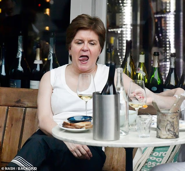 M_Steeples's tweet photo. Yet again, clearly 'Blind as a Bat' Nicola Sturgeon fails to spot she's being papped even and gets wacko on the wine with her butch bestie. What a moronic mess. #NicolaSturgeon #SNPScum https://t.co/yaH4LUSPLT