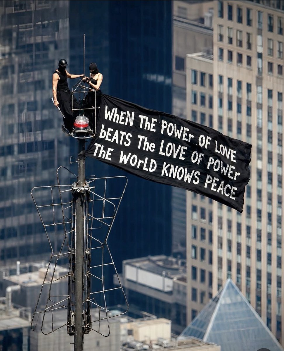 AzamNigre's tweet photo. THE COUPLE WHO CLIMBED THE Empire State Building... have been chasing heights for years.

Angela Nikolau and Ivan Beerkus were arrested after climbing the building's 1,454-foot antenna and unfurling a banner that read, "When the power of love beats the love of power, the world knows peace."

Before being taken into custody, Ivan appeared to propose on a lower platform. The pair are known worldwide for documenting extreme urban climbs and were featured in the Skywalkers: A Love Story.