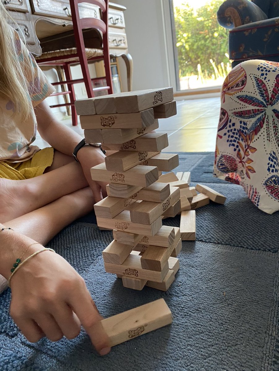 Charles_Herbaux's tweet photo. 🧱 This Jenga tower explains how venetoclax kills cancer cells.

In Jenga, each player pulls a block. The tower holds. Then one player pulls THE one block too many — and everything collapses.

Your cells work the exact same way. Every cell in your body carries a built-in self-destruct program: apoptosis. This program is ready to fire at any moment. What stops it? Protein-blocks holding the tower up. Here's the game:

🔸 The tower = mitochondrial potential
The mitochondrial membrane maintains a tension, an electrical potential. As long as the tower stands, the cell lives. If the tower collapses — if the potential collapses — cytochrome c escapes, caspases activate, and the cell dies. Irreversibly.

🔸 The stabilizing blocks = anti-apoptotic proteins (BCL-2, MCL-1, BCL-XL)
These proteins sit on the mitochondria like Jenga blocks. They restrain the killer proteins (BAX, BAK) and keep the tower from falling. More blocks, more stable tower. Less vulnerable cell.

🔸 The blocks being pulled = BH3-only proteins (BIM, BAD, NOXA, PUMA)
With every stress — DNA damage, survival signal deprivation, chemotherapy — the cell produces these small BH3-only proteins that neutralize a stabilizing block. One by one, blocks are removed. The tower starts to wobble.

🔸 Venetoclax = the player who pulls the BCL-2 block
Venetoclax is a specific BCL-2 inhibitor. It doesn't touch MCL-1. It doesn't touch BCL-XL. It targets one single block — and pulls it out.
If the tower was mainly held up by BCL-2 → it collapses → the cell dies. This is CLL, where BCL-2 is often THE load-bearing block.
If the tower was held up by MCL-1 → pulling BCL-2 changes nothing → the cell resists. This is one mechanism of venetoclax resistance in AML and some lymphomas.

And this is where it gets exciting.

BH3 profiling is a functional assay that measures, BEFORE treatment, how wobbly the tower already is — and above all, WHICH block is holding it up.
→ Very unstable tower ("primed" cell) = high BCL-2 dependence = venetoclax will work
→ Solid tower, stabilized by MCL-1 = a different strategy is needed

We're no longer just looking at mutations. We're testing the physics of the tower. Playing Jenga in vitro before playing it on the patient.

Next time you see a Jenga tower wobble, think of your mitochondria. They're playing the same game. All the time.

#venetoclax #apoptosis #BCL2 #BH3profiling #CLL #leukemia #hematology #oncology #MedTwitter