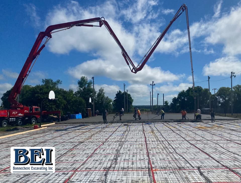 bonnechereexc's tweet photo. Heat wave or not, hockey is always on our minds. 🏒 Our crew recently completed the new concrete slab at the Douglas Rink for our friends at #DouglasRecreation in @AdmastonBromley. Proud to help build community spaces! #RenfrewCounty #OttawaValley #TheBigBlue https://t.co/heHHKGUZg4