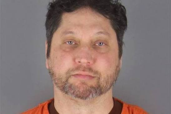 MAGAts_Exposed's tweet photo. Meet MAGAt and convicted felon Anthony Kazmierczak, who pleaded guilty to federally assaulting U.S. Rep. Ilhan Omar after attacking her at a town hall.

During the event, Omar was speaking to constituents and calling for the abolishment of ICE and the resignation of Homeland Security Secretary Kristi Noem. Kazmierczak suddenly rushed the stage and sprayed Omar in the face using a syringe filled with liquid. Security and Minneapolis police officers immediately tackled and arrested him on site.

Rep. Omar was uninjured, refused to let the incident intimidate her, and remarkably continued her town hall presentation for another 25 minutes after Kazmierczak was escorted out.

A federal affidavit later revealed that a close associate of Kazmierczak told authorities he had previously stated regarding Rep. Omar, "Somebody should kill that b***."

According to reports, Kazmierczak was a former network engineer with a lengthy local criminal record, including felony auto theft and multiple DUIs. His social media profiles were heavily filled with pro-Trump rhetoric, intense criticism of the Democratic party, and anti-immigrant views. As he sprayed the congresswoman, he was heard shouting, "She's not resigning. You're splitting Minnesotans apart." A neighbor also stated that Kazmierczak explicitly mentioned he was heading to the town hall that day and knew he "might get arrested."