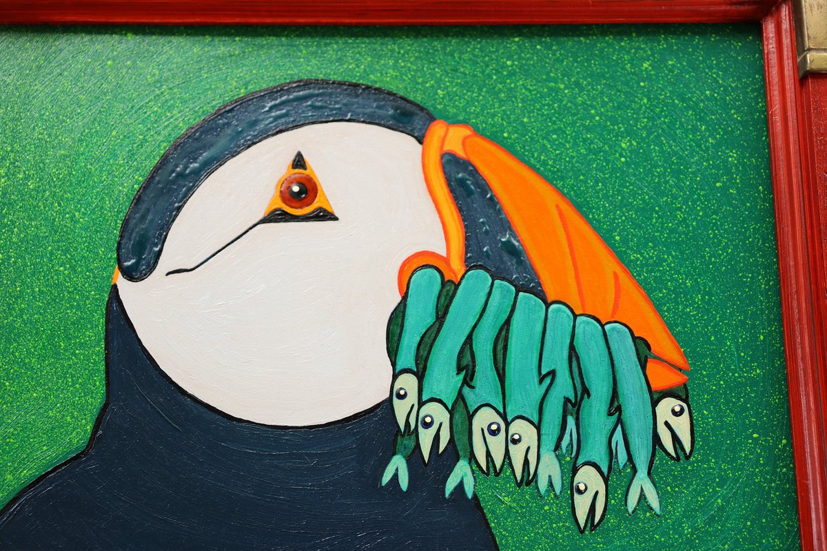 DustDeviltry's tweet photo. The late Bob Ross of The Joy of Painting (PBS 1983-94) was fond of saying "There are no mistakes, only happy accidents."
A rather nice one occurred for me on my last painting, which featured a puffin with a beak full of caplin. The first rendition I posted later struck me as needing some polish, so I set to brushing down a coat of stand oil. The bluish surfaces had been scumbled flat and were dry so it surprised me when the stand oil -- double-rectified linseed oil -- beaded.
I looked at it for a moment before realizing that a puffin emerging from the Atlantic with a beak full of fish should look a little wet. So I applied the mistake to an even larger share of the composition. I think it represents a marginal improvement over the original and I'm glad I went with it. 🇨🇦🎨🐟🕊️