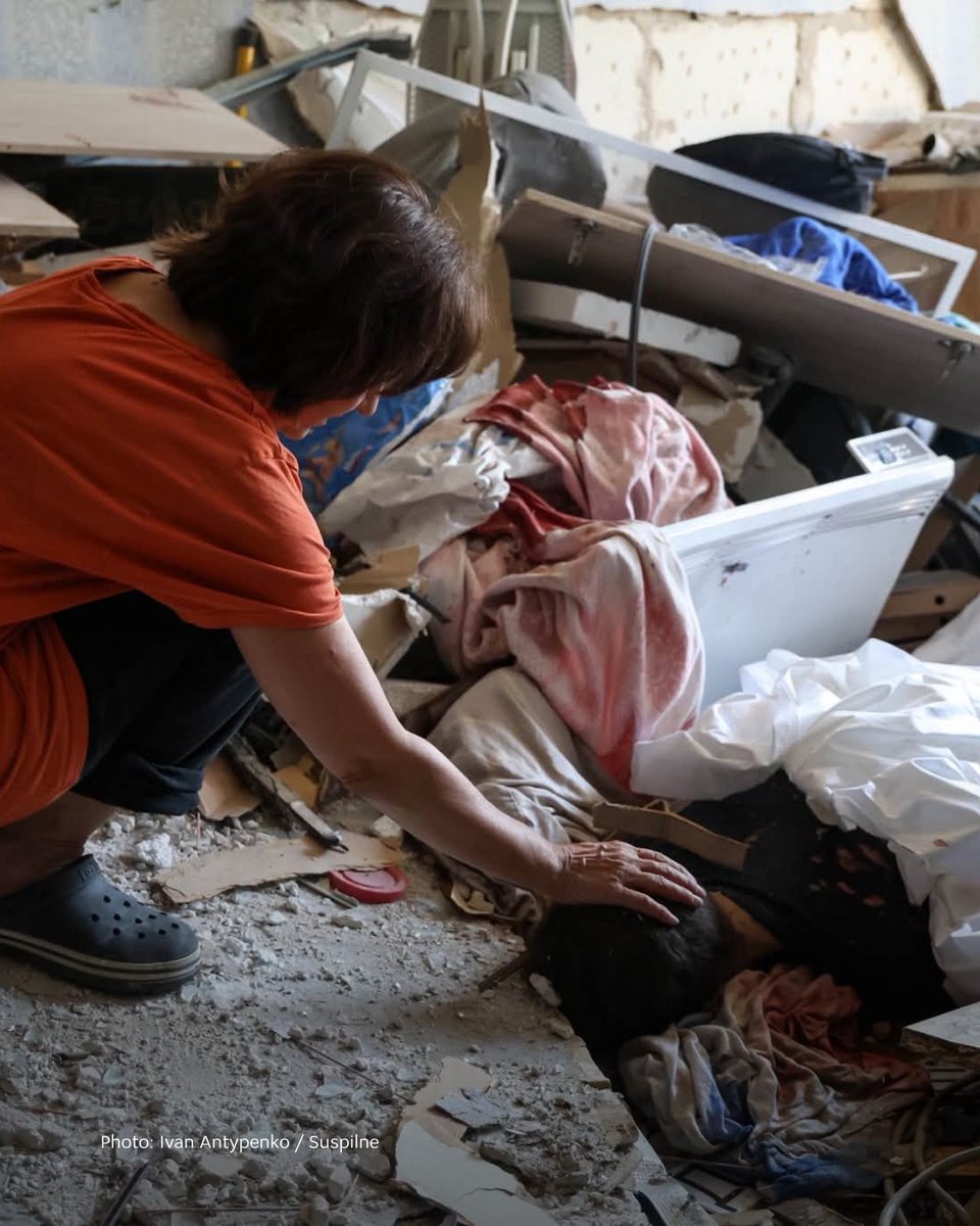 MFA_Ukraine's tweet photo. A mother kneels beside the body of her son, killed by a Russian missile in his own home. There are no words that can capture this grief.

While documenting the aftermath of Russia's attack on Kyiv on July 2, Ukrainian photojournalist Ivan Antypenko was invited inside by Tetiana. "You can come in and look, but my son Roma is lying there. He is dead. He isn't breathing anymore," she told him.

Russia's strike on Kyiv killed 30 civilians and injured dozens more. While the aggressor continues to wage war against human lives, the world must not look away. Russia's impunity must come to an end.