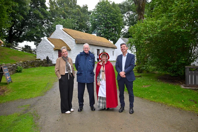Secretary of State Hilary Benn with staff from National Museums NI and the Ulster American Folk Park in Omagh
