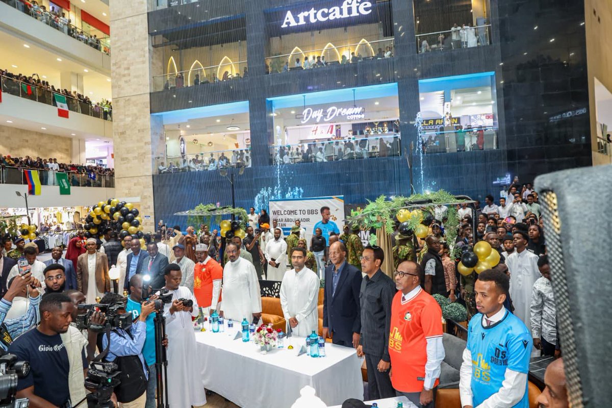 HonAdenDuale's tweet photo. In a display of regional solidarity and support, I presided over a reception ceremony to welcome Somali football referee Omar Abdulkadir Artan, whose historic World Cup opportunity was abruptly halted last month.

The event, held at Eastleigh's prestigious BBS Mall—renowned as the largest shopping complex in East and Central Africa—celebrated Artan's groundbreaking achievement of being selected as the first-ever Somali referee to officiate at a FIFA World Cup tournament. His selection placed him among an elite group of 52 match officials chosen for the 2026 competition, marking a significant milestone for Somali sports on the global stage.

Despite this professional setback, Artan received a warm reception from both the Somali diaspora community and Kenyan supporters.

The event served as both a celebration of his achievements and a statement of cross-border support in the face of disappointment.

I emphasized resilience and perseverance, encouraging young people across East Africa not to be discouraged by obstacles in their pursuit of dreams. It is important to continuing to striving for excellence despite unexpected challenges.

I also outlined deliberate moves by the 5th administration led by HE president William Ruto in supporting sports and talent. 

President William Ruto’s administration allocated KSh 26.4 billion to complete 39 stadiums nationwide to support youth talent this including The newly constructed and soon to be commissioned state of the art 60,000 capacity Talanta Stadium 

This geared towards uplifting talent and successfully hosting the 2027 Africa Cup of Nations (AFCON). This historic continental tournament will be jointly hosted by Kenya, Uganda, and Tanzania under the 'Pamoja Bid'.

Also in attendance was H.E Ahmed Abdullahi (Governor Wajir) H.E Jabril Abdulle (Somalia Ambassador to Kenya) H.E Hussein Mohammed (President FKF) Hon. Farrah Maalim (MP Dadaab) Hon. Yussuf Hassan (MP Kamukunji) and host Abdiweli Maalim (Chairman BBS Mall)