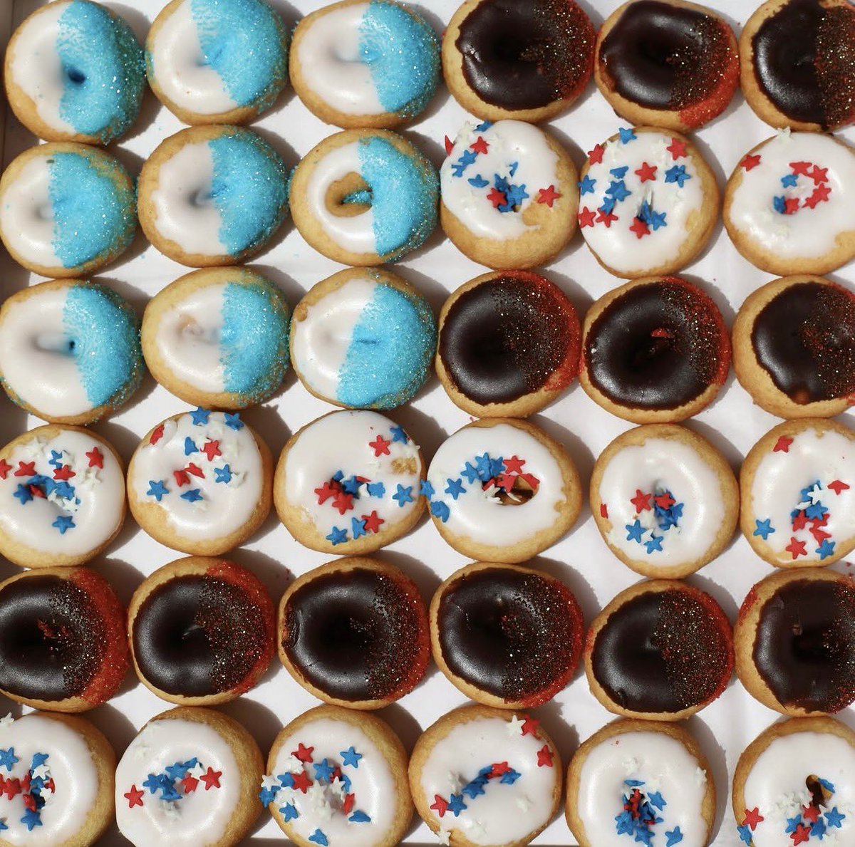 GetMiniDonuts's tweet photo. Kicking off the long weekend 🎆🍩 Fresh mini donuts are perfect for backyard BBQs and 4th of July celebrations all weekend long.

Red, White &amp; Blue flavors are available now through Sunday for pickup or delivery. Don’t show up empty-handed 🇺🇸 https://t.co/TZughiDdLK